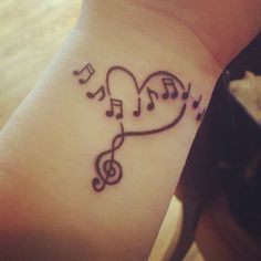 a heart with musical notes on the wrist