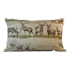 a pillow with deer and elk on it