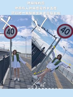 a woman standing next to a street sign on top of a bridge under a blue sky