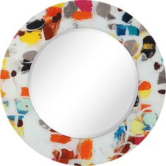 a round mirror with colorful paint splattered on it's sides and an oval frame