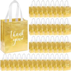 gold foiled bags with thank you written on the front and bottom in white ink