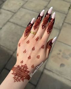 a woman's hand with hennap and paw prints on the palm,