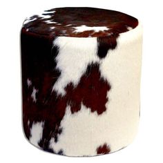 a brown and white cow print stool on a white background with the top half off