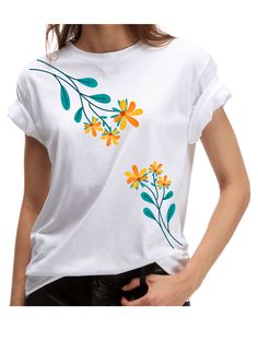 a woman wearing a white t - shirt with colorful flowers on the front and side