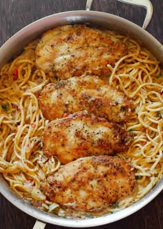 some chicken and noodles in a pan on a table