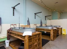 two sinks in a room with blue walls