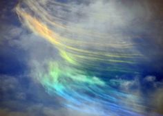 a rainbow colored cloud in the sky