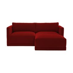 a red couch sitting on top of a white floor