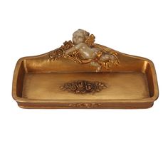 a golden tray with an angel on it