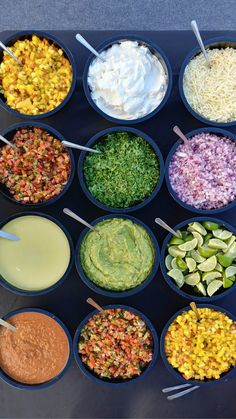 six bowls filled with different types of food and dips in them on a table