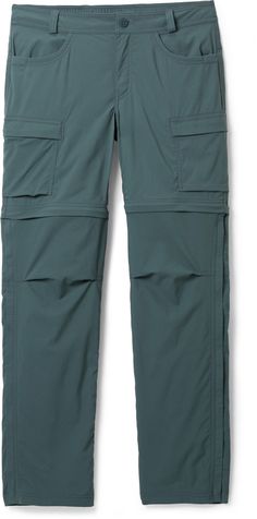 the back view of a pair of green cargo pants with zippers and pockets on each side