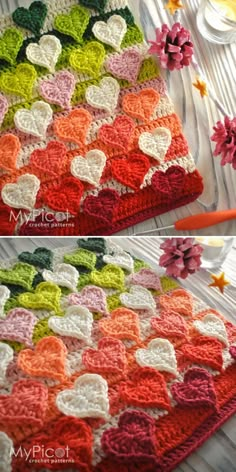 crocheted hearts are displayed on the table