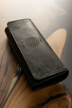 Elevate your style with our exquisite handcrafted black women's wallet. Meticulously crafted from premium black leather, this wallet combines sophistication with functionality. This accessory is designed for those who appreciate both quality and aesthetics. Product Details: Material: Crafted from premium black leather for durability and an elegant, timeless look. 🚩 Personalization: Add a name engraving to the wallet or a special phrase that will make your gift even more unique. Handwork: Each w Black Wallet With Coin Pocket For Personal Use, Luxury Black Trifold Wallet For Daily Use, Black Clutch Wallets As Gift, Black Trifold Wallet For Personal Use, Luxury Black Trifold Wallet For Everyday Use, Leather Wallets With Rectangular Case For Gift, Black Handmade Trifold Wallet For Daily Use, Handmade Black Trifold Wallet For Everyday Use, Handmade Black Wallets For Travel