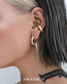 a close up of a person with ear piercings