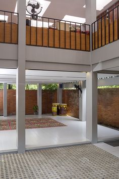 the inside of a house with multiple floors and balconies on top of them