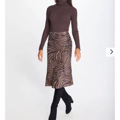 Cut On The Bias And Cast In A Silky Rayon Satin, Our Leopard Print Skirt Is Spring's It Piece. Zip Closure Bias Cut 100% Rayon Satin Dry Clean Only. Size & Fit 29" Long From Top Of Center Back (Size M) Model Is 5'9" And Wearing A Size Xs Brown Party Bottoms With Flowy Fit, Brown Pleated Skirt For Night Out, Brown Skirt For Fall, Brown Lined Skirt For Fall, Brown Midi Skirt For A Night Out, Brown Midi Skirt For Night Out, Brown Flared Skirt For Party, Brown Midi Skirt For Fall, Brown Lined Skirt For Winter