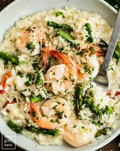 shrimp and rice with asparagus in a white bowl