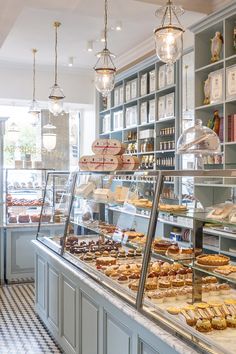 a bakery filled with lots of different types of pastries and desserts on display