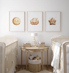 a baby's room with two cribs and three pictures on the wall