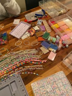 the table is covered with beads and other crafting supplies