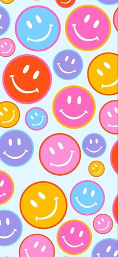 many different colored smiley faces on a light blue and pink background with white circles in the middle