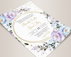 an elegant floral wedding save the date card with gold foil and blue flowers on it