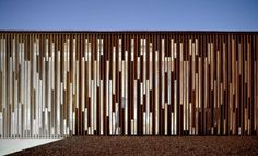 the side of a building with wooden slats on it