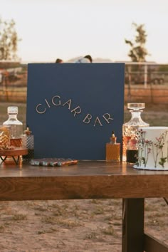 A cigar bar is the perfect way to tie in a unique and personal element into your summer outdoor wedding! Outdoor wedding ideas, backyard wedding ideas, cigar bar, wedding bar ideas, wedding bar inspiration, signature cocktail for wedding, farm wedding, wildflower wedding theme. For more unique wedding ideas check out this blog post at jaidynmichele.com Bar Ideas Wedding, Wedding Cigars, Wedding Ideas Backyard, Wedding Bar Ideas, Wedding In Arizona, Summer Outdoor Wedding, Wildflower Wedding Theme, Unplugged Ceremony, Wedding Farm