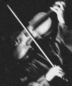 black and white photograph of a man playing the violin