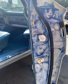 a car door is decorated with an image of a woman's body and hat