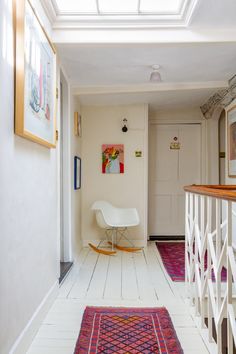 the hallway is clean and ready to be used as a living room or dining area