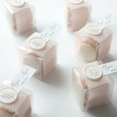 four soaps with labels on them sitting next to each other