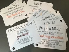 four white tags with words on them that say, i give thanks to the lord