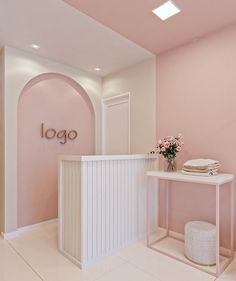 a pink and white room with a sign that says logo on the wall next to it