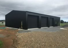 two black garages sitting next to each other