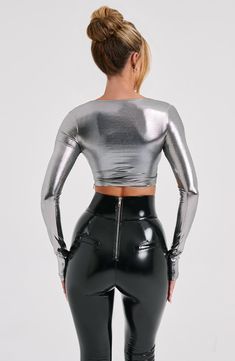 Our metallic Kyranni top oozes glamour, made from a luxe semi sheer jersey that moulds to your body figure for the dreamiest fit. The top has long sleeves, flattering high neckline and looks amazing worn over the Macy bralette with the Cassidy pants.


Colour: Gunmetal.

Metallic semi sheer jersey.

Long sleeves.

High neck.

Moulds to body figure.

Cropped length.

Model is an XS and is wearing an XS.

 Size: XS, S, M, L, XL, XXL Homecoming Dresses Corset, Silk Crop Top, Body Figure, Maxi Dress Sale, Sparkle Dress, Dresses By Length, Formal Dresses Prom, T Shirt Women, Prom Party Dresses