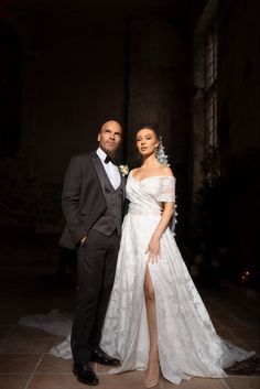 a man and woman in formal wear posing for a photo at the end of their wedding day