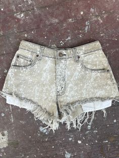 Bleached Levi's denim shorts, fits size 26/27 best. Found these denim Levi's shorts at a thrift store in high school and decided to try and give them a facelift. Tag says waist is a size 30, but these have shrunken a bit. These shorts are short, so they show a bit of booty.  If you have questions or would like exact measurements, just message me. All sales are final. Acid Wash Distressed Jean Shorts, Distressed Acid Wash Jean Shorts, Faded Distressed Jean Shorts For Summer, Summer Distressed Faded Jean Shorts, Acid Wash Jean Shorts With Frayed Hem, Trendy Washed Faded Shorts, Trendy Faded Washed Shorts, Faded Washed Jean Shorts For Summer, Faded Distressed Cotton Shorts