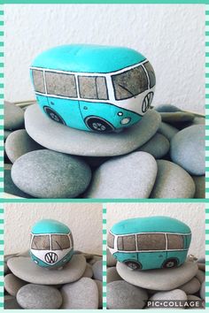 a blue and white bus sitting on top of rocks next to a pile of stones