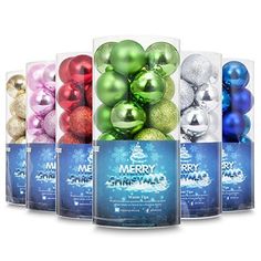 six christmas ornaments in clear boxes with merry message on the front and bottom, all different colors