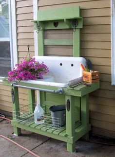 an outdoor sink with flowers on the outside