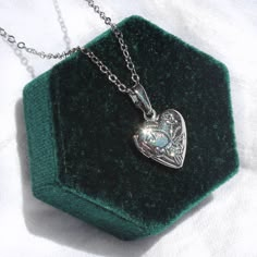 This necklace is 16" long and features a little heart shaped locket pendant. All materials are silver plated and tarnish resistant. Silver Necklace Prom, Heart Locket Necklace Silver, Heart Shaped Locket, Heart Locket Necklace, Locket Pendant Necklace, Heart Shaped Necklace, Floral Heart, Silver Lockets, Silver Heart Necklace