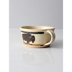 a ceramic bowl with an animal design on it