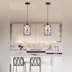 three lights hanging from the ceiling over a kitchen island