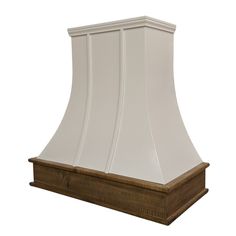 a white range hood on a wooden stand against a white background with the light reflecting off it's sides