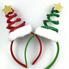 two headbands with christmas trees and stars on them, one is green and the other is red