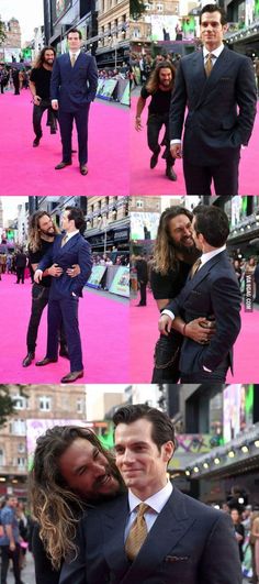 two men in suits are hugging on the pink carpet