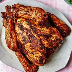 a close up of a chicken on a plate