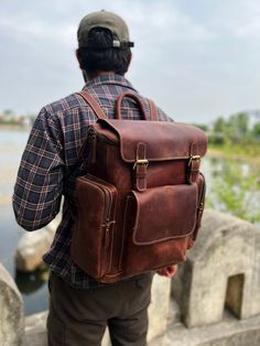 Handmade Leather Backpack, Leather Rucksack, Personalised Leather Laptop Backpack Dimensions: 12 X 16 X 6 Inches The Leather Backpack is beautifully crafted while ensuring the durability and utility respective to all kinds of outdoor activities. The product is made by using 100 % Buffalo leather with Polyester lining. We have used premium quality Waxed Buffalo leather. The Backpack contains 2 spacious compartments for books, files and a laptop. One of the compartments is well padded for Laptop / Large Capacity Brown Leather Backpack For Adventure, Brown Large Capacity Leather Backpack For Adventure, Leather Backpack With Large Capacity For Outdoor, Rugged Rectangular Backpack With Leather Backing, Large Capacity Leather Backpack For Outdoor, Outdoor Leather Backpack With Large Capacity, Large Capacity Leather Bags For Adventure, Leather Laptop Backpack For Outdoor, Large Capacity Leather Shoulder Backpack For Outdoor