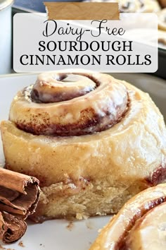 cinnamon rolls on a plate with text overlay reading dairy - free sourdough cinnamon rolls